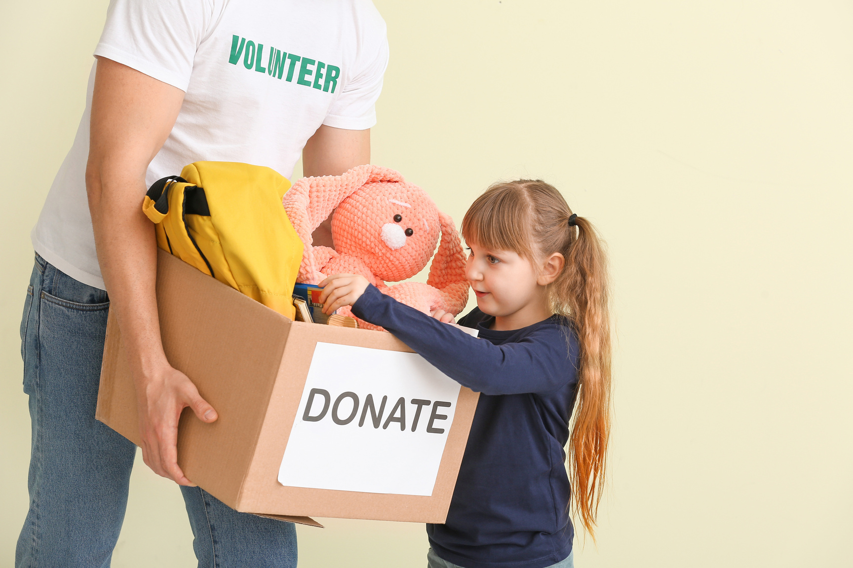 Volunteer with Donations for Orphans and Little Child